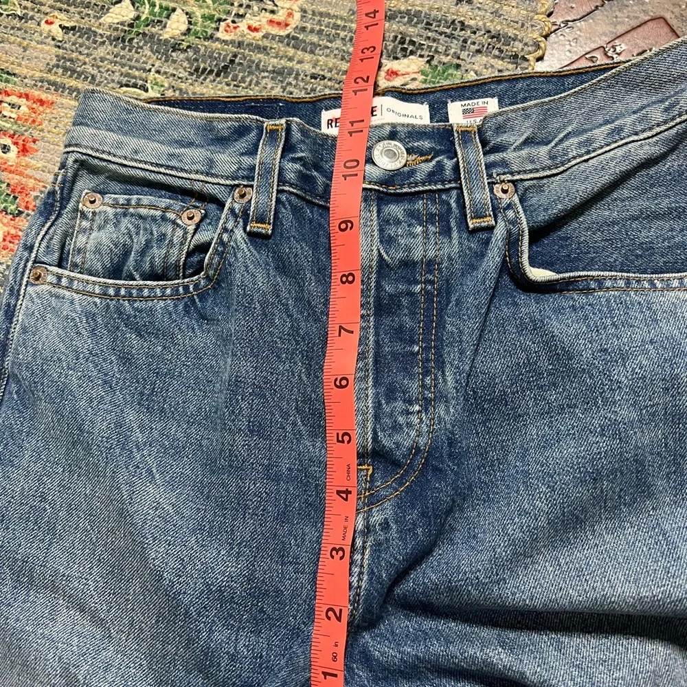 Re Done high rise stove pipe raw frayed hem denim jeans